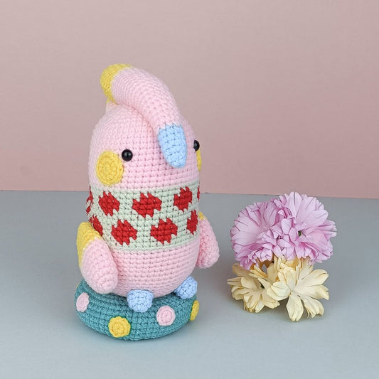 Adorable pink amigurumi cockatoo