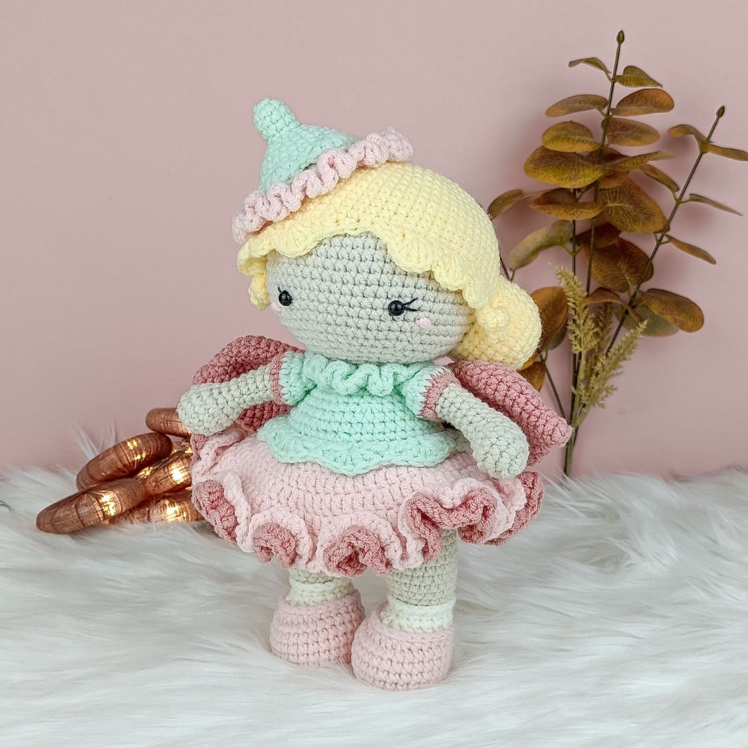 Amigurumi fairy with pink wings