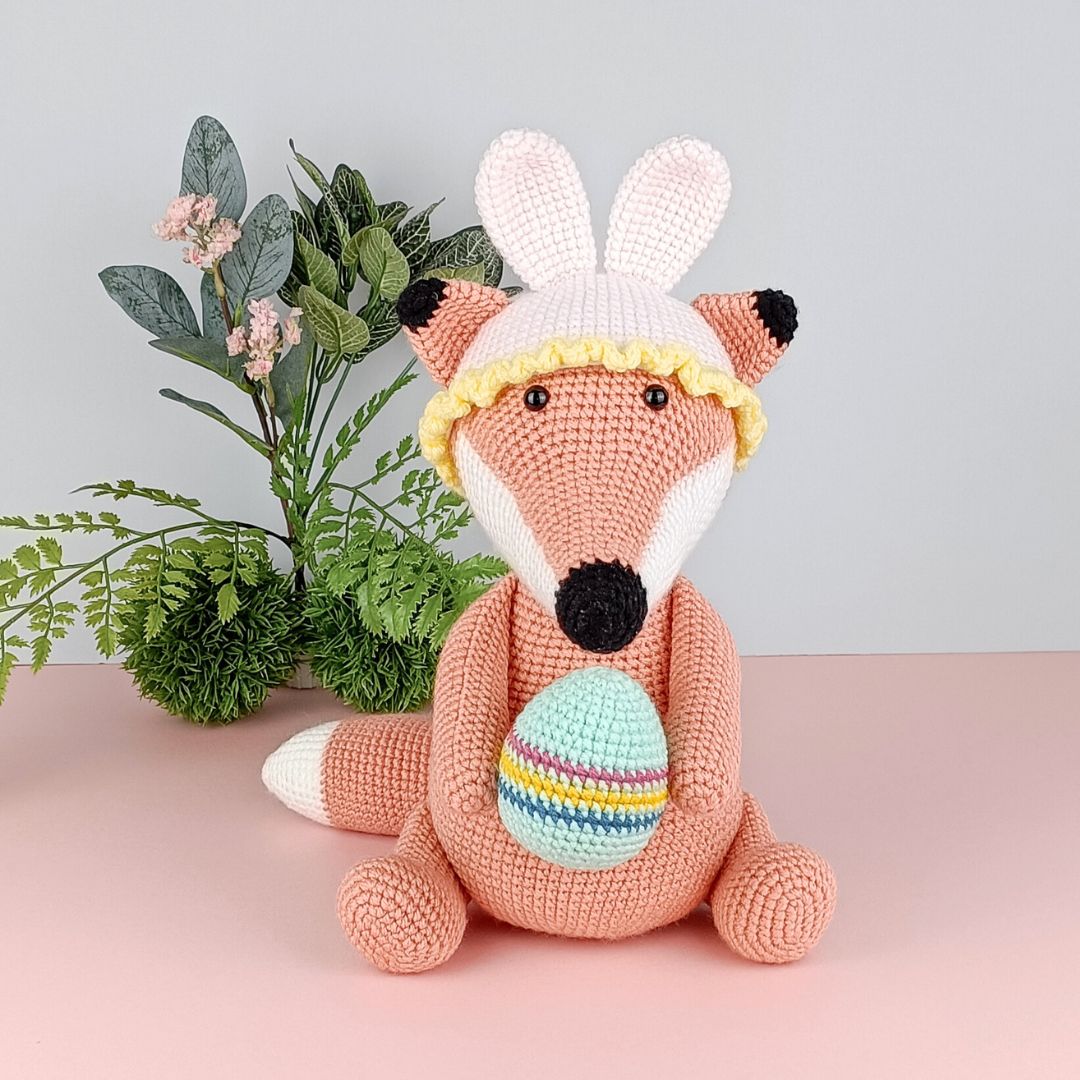 Cute crochet fox holding an Easter egg