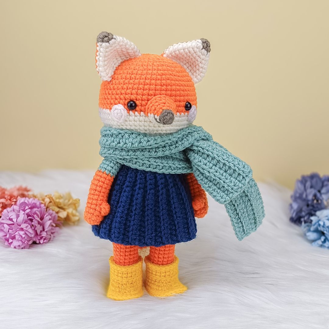 Cute crochet orange fox in blue dress