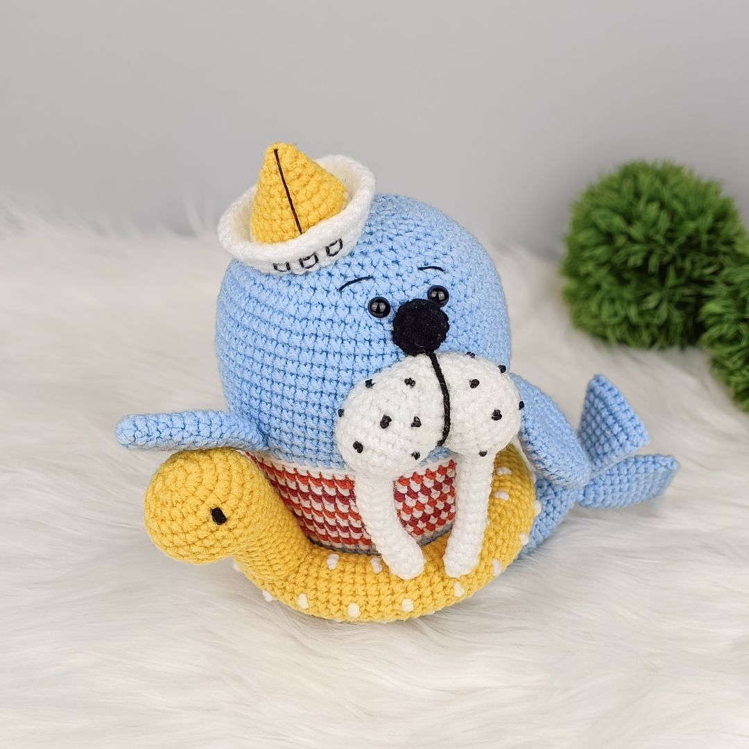 Walrus amigurumi with yellow hat