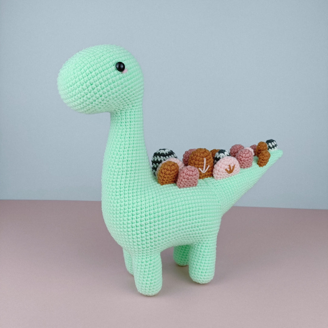 Spiky green colour stuffed dinosaur