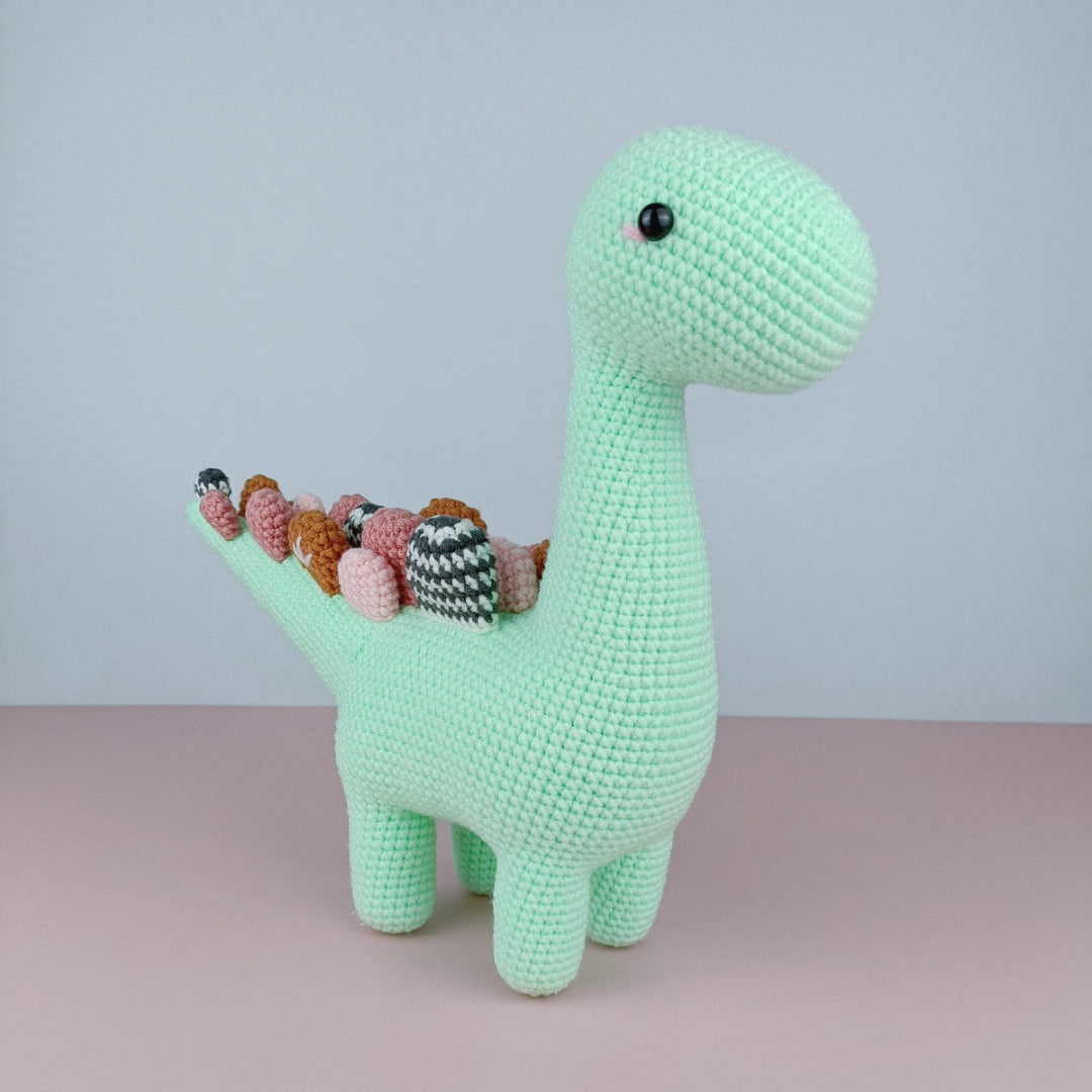 Cute crochet dinosaur with spiky long tail